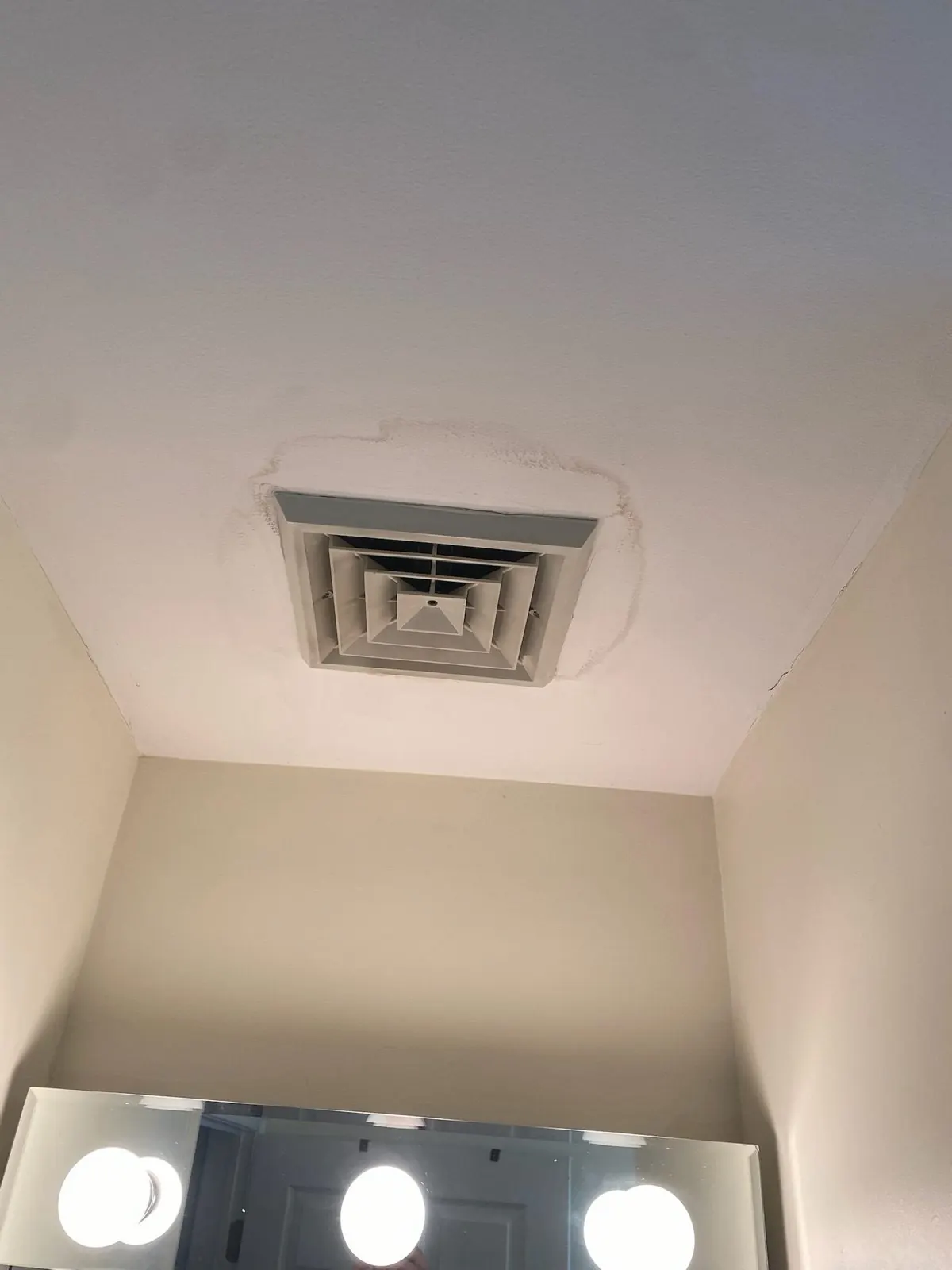 Air movers and dehumidifier drying a water-damaged room.